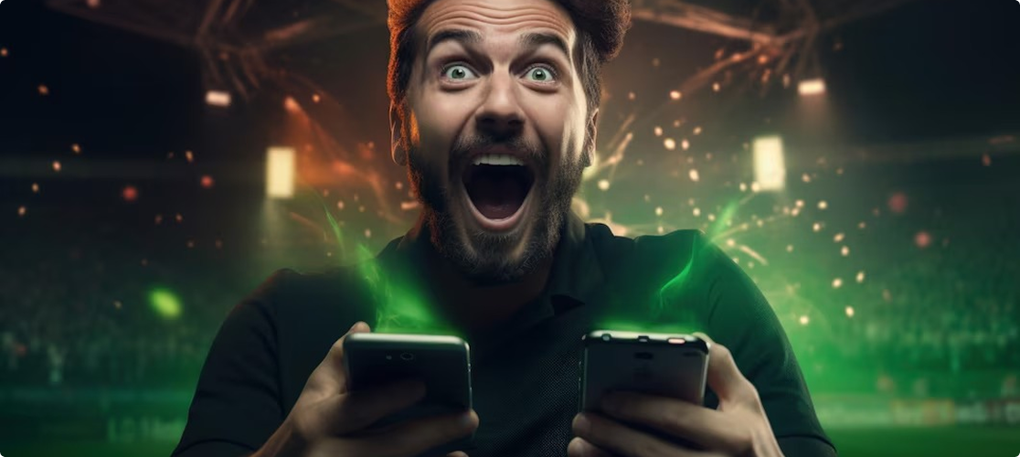 Gracz z telefonami pokazujący radość z sukcesu w grze
